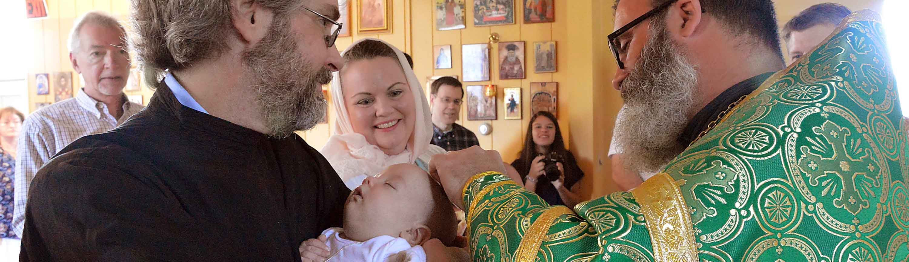 Father Christopher Chrismating a Baby
